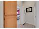 Hallway with tile flooring leading to a bedroom, with storage cabinets on the side at 715 Heritage Point Dr, Henderson, NV 89002