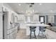 Open-concept kitchen with a large island, stainless appliances, and seamless transition to the living area at 715 Heritage Point Dr, Henderson, NV 89002