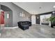 Bright living room features tile floors, modern lighting, backyard views, and an open layout at 715 Heritage Point Dr, Henderson, NV 89002