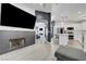 Open-concept space showcasing the living room, fireplace, and adjacent kitchen at 715 Heritage Point Dr, Henderson, NV 89002