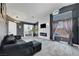 Cozy living room with tile floors, modern fireplace, and large windows for natural light at 715 Heritage Point Dr, Henderson, NV 89002