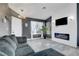 Inviting living room featuring tile floors, a sleek fireplace, and neutral color palette at 715 Heritage Point Dr, Henderson, NV 89002