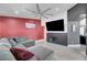 Comfortable living room with a ceiling fan, large TV, and neutral decor at 715 Heritage Point Dr, Henderson, NV 89002