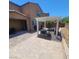 Well-designed backyard features a covered patio and a pergola-covered seating area at 7160 Mineral Park Ave, Las Vegas, NV 89179