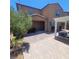 Expansive backyard combines a covered patio, stylish pergola, and landscaped areas at 7160 Mineral Park Ave, Las Vegas, NV 89179