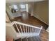 View of the living room from the top of the stairs showcasing an open floor plan at 7160 Mineral Park Ave, Las Vegas, NV 89179
