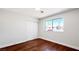 Bright bedroom with hardwood floors and closet; natural light from the window at 744 Hubbard St, Las Vegas, NV 89110
