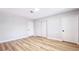 Bedroom with hardwood floors, neutral paint, closet, and modern lighting at 744 Hubbard St, Las Vegas, NV 89110