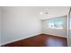 Bedroom with hardwood floors and closet; natural light from the window at 744 Hubbard St, Las Vegas, NV 89110