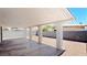 View of the open carport attached to the house with gravel and a concrete base at 744 Hubbard St, Las Vegas, NV 89110