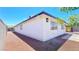 Side view of a well-maintained single-story home with clean white exterior at 744 Hubbard St, Las Vegas, NV 89110