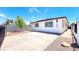 Charming single story home featuring a spacious driveway and well-maintained yard at 744 Hubbard St, Las Vegas, NV 89110