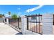 Exterior of the home with secure fencing at 744 Hubbard St, Las Vegas, NV 89110