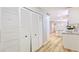 Hallway view with wood flooring and built-in storage with easy access to kitchen and other rooms at 744 Hubbard St, Las Vegas, NV 89110