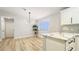 Bright kitchen featuring marble countertops, gray backsplash, and modern lighting at 744 Hubbard St, Las Vegas, NV 89110
