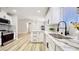 Well-lit kitchen featuring stainless steel appliances, sleek cabinets, and elegant countertops at 744 Hubbard St, Las Vegas, NV 89110
