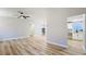 Spacious living room features wood-look floors, a contemporary light fixture, and neutral paint at 744 Hubbard St, Las Vegas, NV 89110