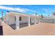 Side view of spacious covered patio providing shade, connecting to the backyard and side entrance at 744 Hubbard St, Las Vegas, NV 89110