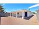 Back of the property highlighting the carport, rock landscaping, and access to the home at 744 Hubbard St, Las Vegas, NV 89110