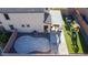 Aerial view of backyard featuring an artificial lawn, patio, landscaping, and covered area at 7468 Wellfleet Bay Ave, Las Vegas, NV 89179