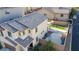 Aerial view of a home with a backyard featuring an artificial lawn, play structure, and gravel space at 7468 Wellfleet Bay Ave, Las Vegas, NV 89179