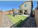 Spacious backyard with artificial turf, playground, patio and privacy walls, perfect for outdoor enjoyment at 7468 Wellfleet Bay Ave, Las Vegas, NV 89179