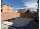 Private backyard with desert landscaping and brick perimeter wall at 7468 Wellfleet Bay Ave, Las Vegas, NV 89179