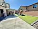 Spacious backyard offers a covered patio, artificial turf, and a designated play area for outdoor fun at 7468 Wellfleet Bay Ave, Las Vegas, NV 89179