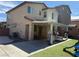 A spacious backyard featuring a covered patio, artificial turf, and play areas at 7468 Wellfleet Bay Ave, Las Vegas, NV 89179