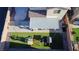 Overhead shot of a backyard including a pool, covered patio, and play area on artificial turf at 7468 Wellfleet Bay Ave, Las Vegas, NV 89179