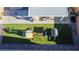 Aerial view of a backyard featuring a playground on artificial turf and a covered patio at 7468 Wellfleet Bay Ave, Las Vegas, NV 89179