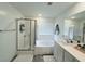Bathroom showcasing a shower, tub, and vanity with generous counter space at 7468 Wellfleet Bay Ave, Las Vegas, NV 89179