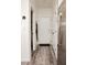 Hallway with sleek flooring leads to the front door, complemented by modern fixtures and storage, blending style with function at 7468 Wellfleet Bay Ave, Las Vegas, NV 89179
