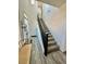 Entryway featuring staircase, wood-look flooring, and a bench at 7468 Wellfleet Bay Ave, Las Vegas, NV 89179