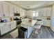 Bright kitchen with an island, modern appliances, and white countertops at 7468 Wellfleet Bay Ave, Las Vegas, NV 89179