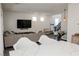 Bright open living area with modern furnishings, perfect for gatherings, connects seamlessly to the kitchen and dining spaces at 7468 Wellfleet Bay Ave, Las Vegas, NV 89179