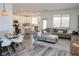 Open-concept living space flows into a well-equipped kitchen, featuring ample seating and modern finishes, perfect for entertaining at 7468 Wellfleet Bay Ave, Las Vegas, NV 89179