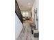 Bright living room with neutral decor, modern staircase, and stylish wood-look floors. Perfect for relaxing and entertaining at 7468 Wellfleet Bay Ave, Las Vegas, NV 89179