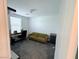 Office space with desk, comfortable sofa, and neutral decor, perfect for working from home at 7468 Wellfleet Bay Ave, Las Vegas, NV 89179