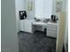 A small office features neutral carpet and built-in desk with cabinets at 7468 Wellfleet Bay Ave, Las Vegas, NV 89179