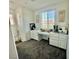 Bright office space with built-in cabinetry, a large window, and neutral decor at 7468 Wellfleet Bay Ave, Las Vegas, NV 89179