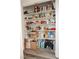 Spacious walk-in pantry with ample shelving for storage and organization at 7468 Wellfleet Bay Ave, Las Vegas, NV 89179