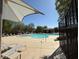 The community pool offers lounge seating, shade, and clear water! at 7468 Wellfleet Bay Ave, Las Vegas, NV 89179
