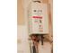 Tankless water heater for on-demand hot water, offering energy efficiency and space-saving design in your home at 7468 Wellfleet Bay Ave, Las Vegas, NV 89179