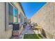 Inviting backyard patio with stone pavers and well-maintained surroundings at 7533 Garnet Moon St, North Las Vegas, NV 89084