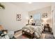 Inviting bedroom showcasing layered rugs, cozy bedding, and stylish decorative accents at 7533 Garnet Moon St, North Las Vegas, NV 89084
