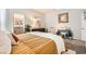Comfortable bedroom with a decorative wall art, a plush bed with cozy bedding, and soft, neutral tones at 7533 Garnet Moon St, North Las Vegas, NV 89084