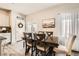 Dining area featuring modern table set, elegant lighting and decorative accents at 7533 Garnet Moon St, North Las Vegas, NV 89084
