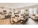 Open-concept living room with hardwood floors, stylish furniture, and abundant natural light at 7533 Garnet Moon St, North Las Vegas, NV 89084