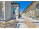Well-maintained side exterior featuring stone walkway with desert landscaping for a modern look at 7533 Garnet Moon St, North Las Vegas, NV 89084